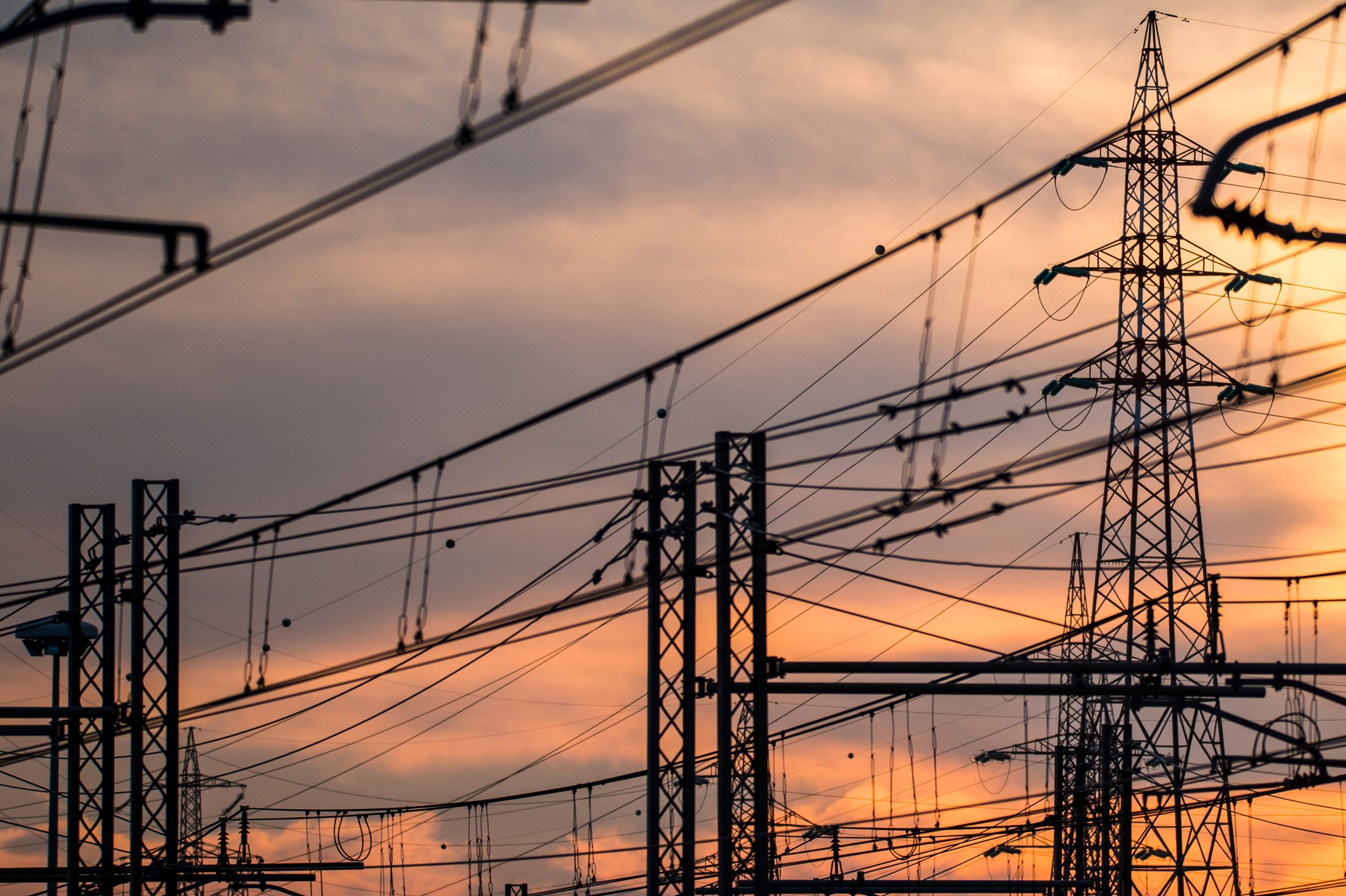 Silhouette of the electricity transmission pylon at sunset